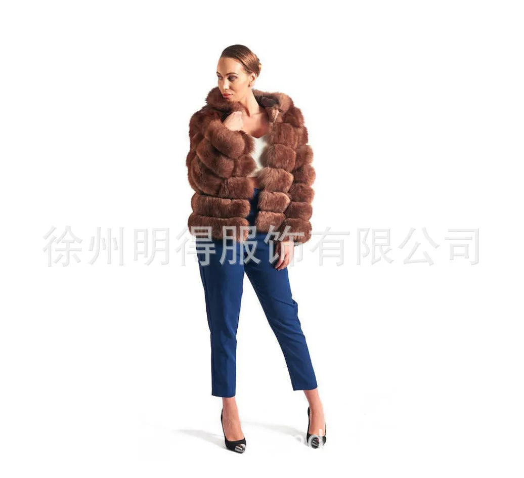 Women's loose fit artificial fur hooded coat in white silver fox colour on a hanger.