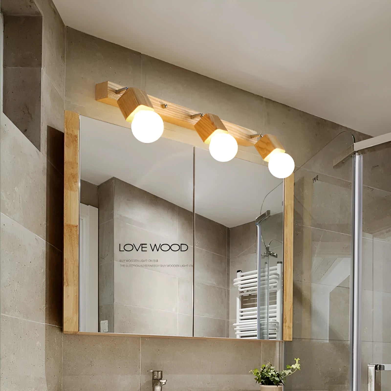 Compact 24cm LED wall lamp with a mirrored cabinet design mounted on a wall.
