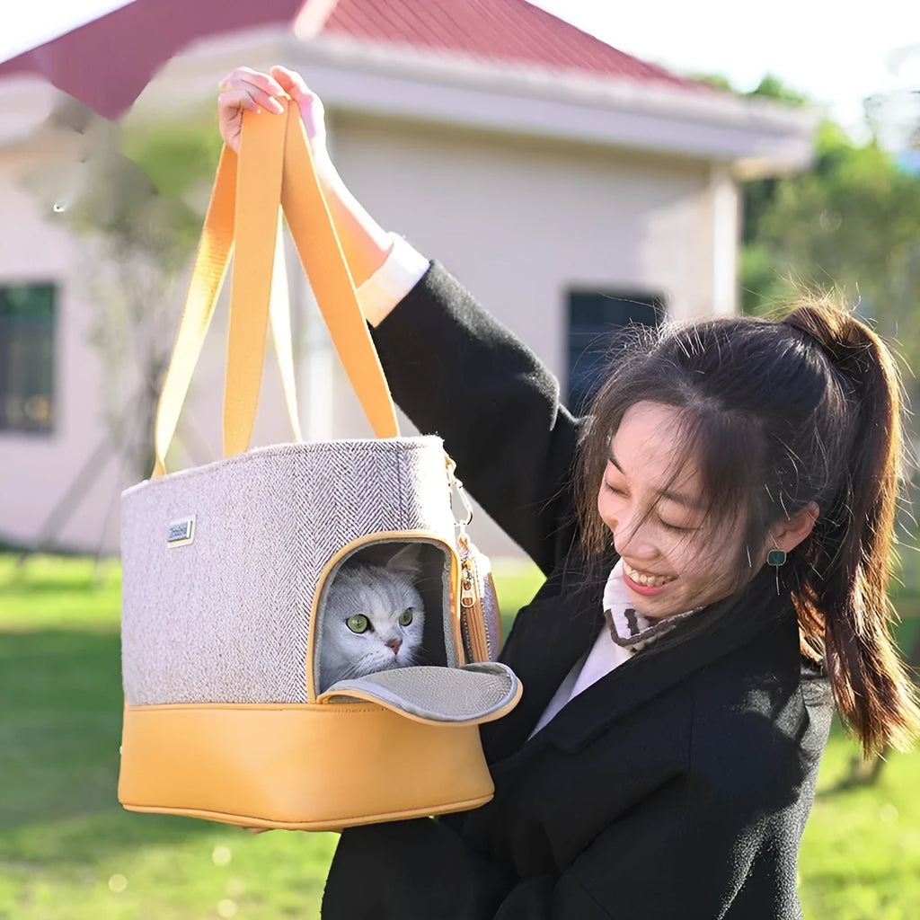 Portable pet backpack in beige brown with breathable space capsule, wool PU construction, side view