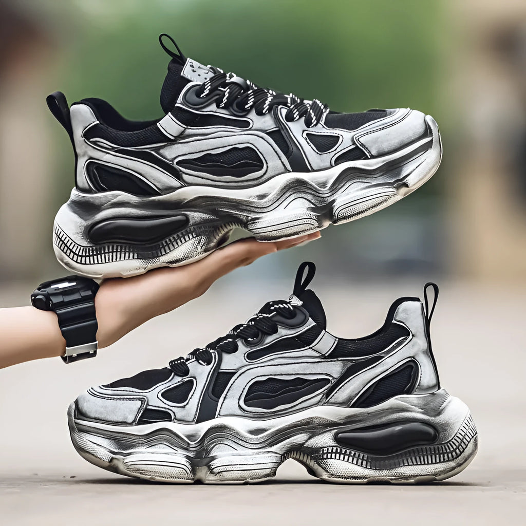 Men's black and white mesh sneakers with a platform sole and lace-up front on a plain background.