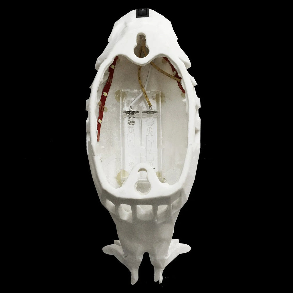 3D print resin wall lamp shaped like an owl projecting light and shadow onto a wall