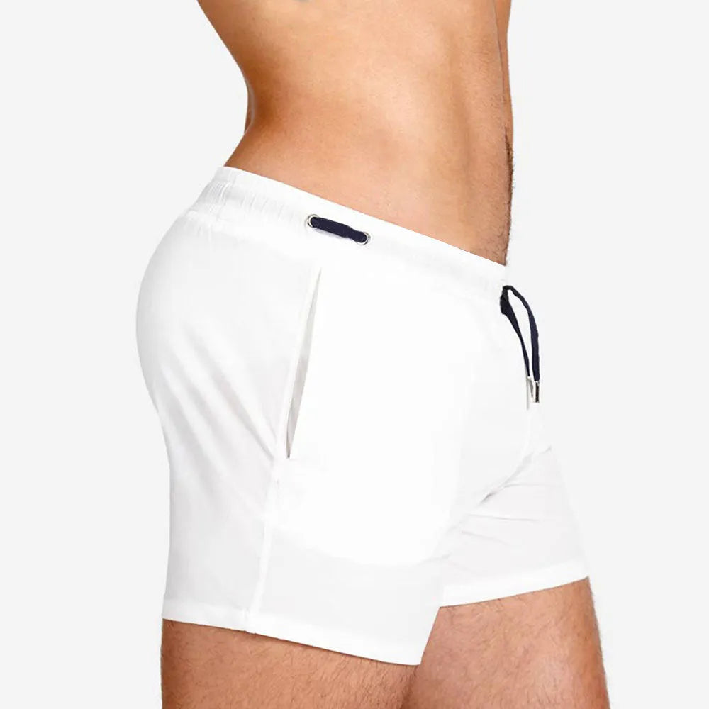 Men's solid colour polyester sports shorts with mesh lining in six colour options