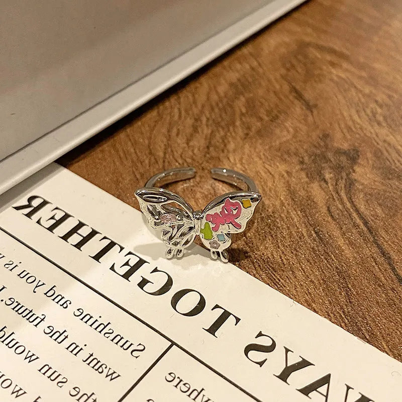 Simple copper women's ring with a Chinese butterfly design, showing an example from the 33 available numbered styles.