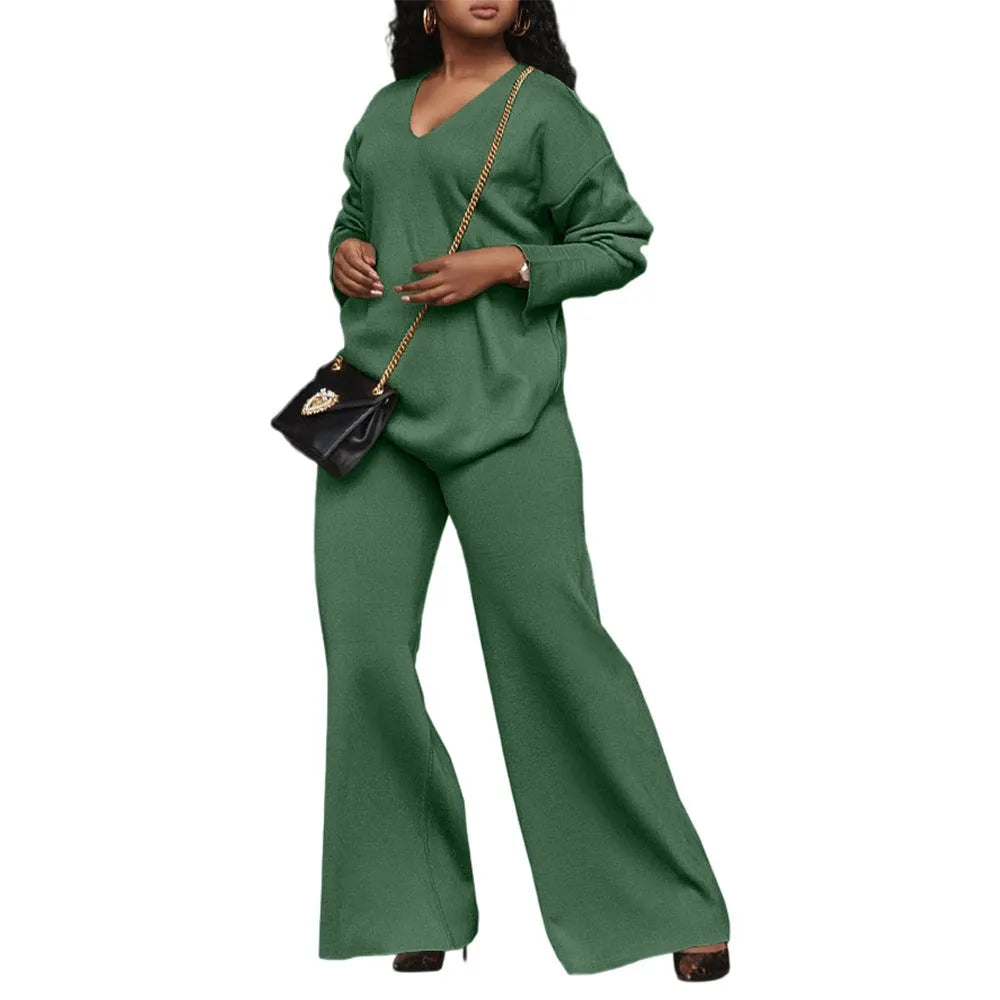 Women's brown suede two-piece casual suit with long sleeves and trousers on a model.