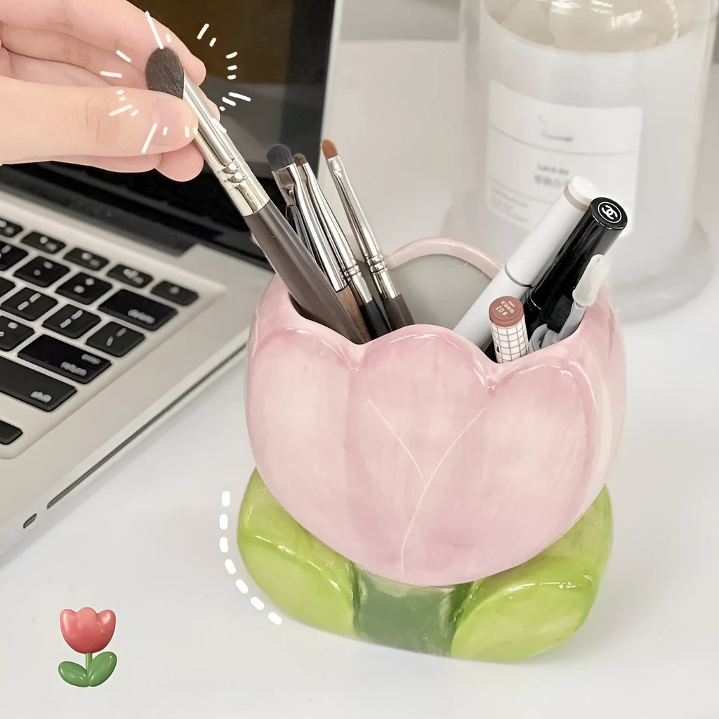 Ceramic pen holder storage box with floral pattern decoration on desktop