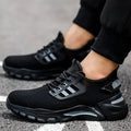 Men's black Flyknit work shoes with steel toe caps showing low-top safety footwear design
