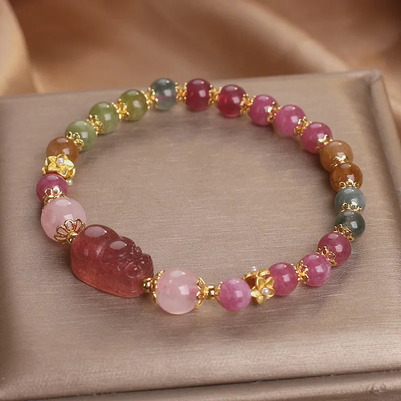 Pink and red candy colour crystal bracelet with tourmaline and strawberry quartz stones, 17 cm length.