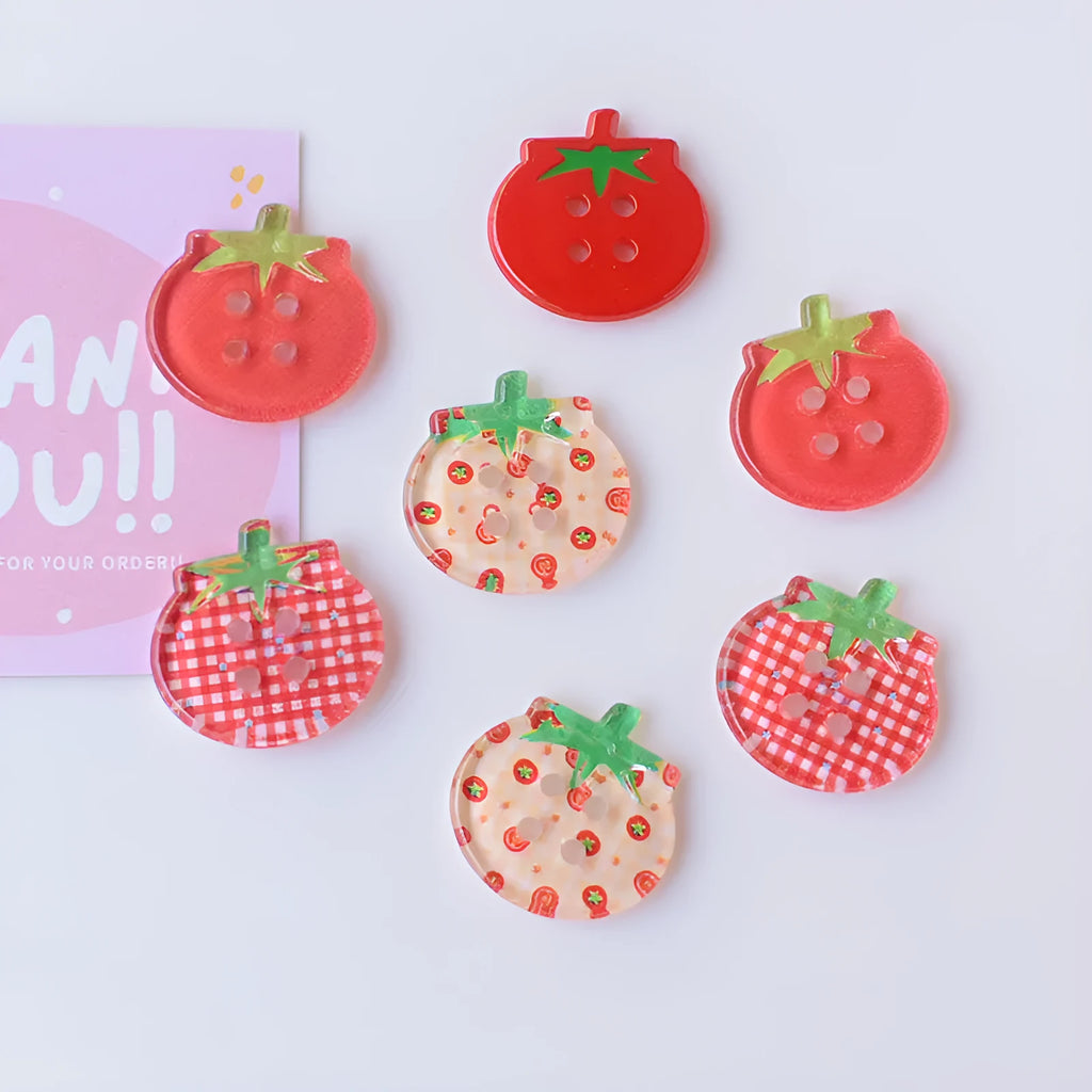 Medium tomato-themed plastic buttons in red colour variations including cherry tomato printing and solid red