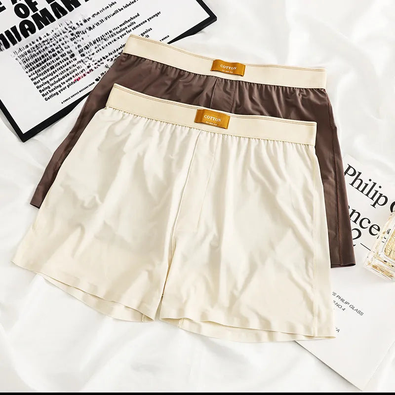 Men's loose fit ice silk underwear in solid colours showing mid-waist design and knitted fabric texture