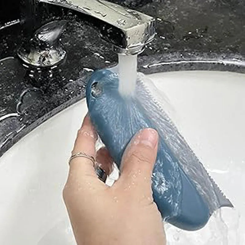 Dark blue pet hair remover brush with double serrated comb on a car seat