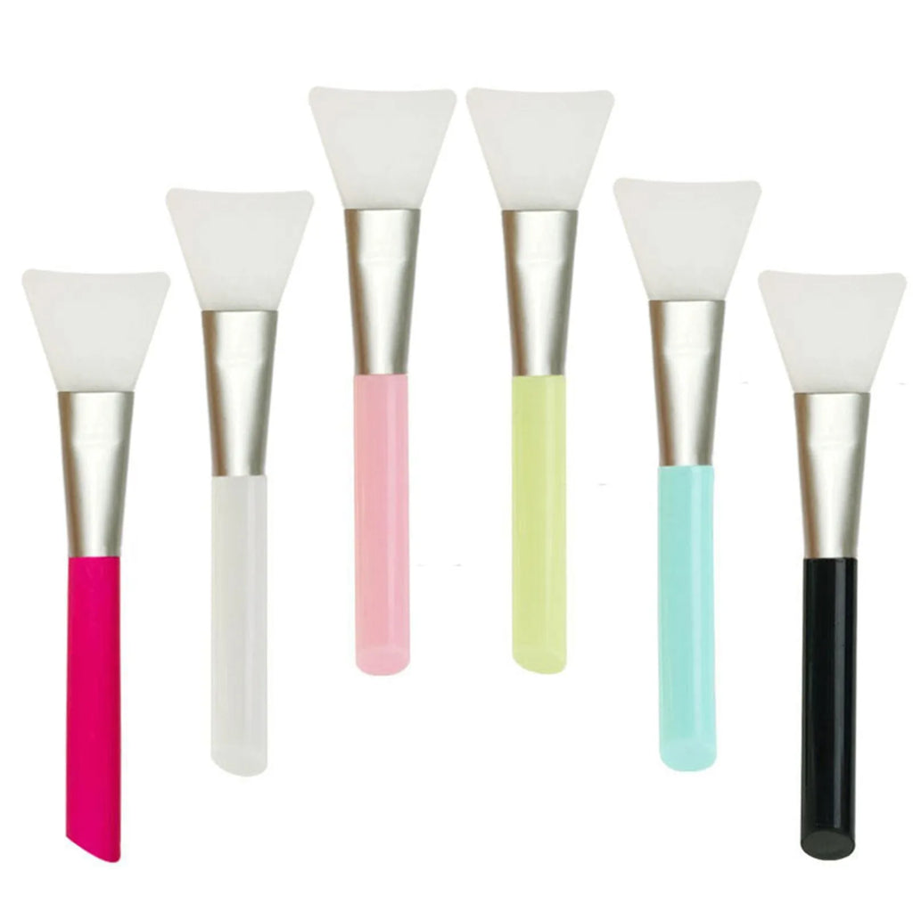 Reusable silicone face and body mask applicator spatula in six colours on a white background.