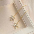 Long style gold dangle earrings for women with metal construction