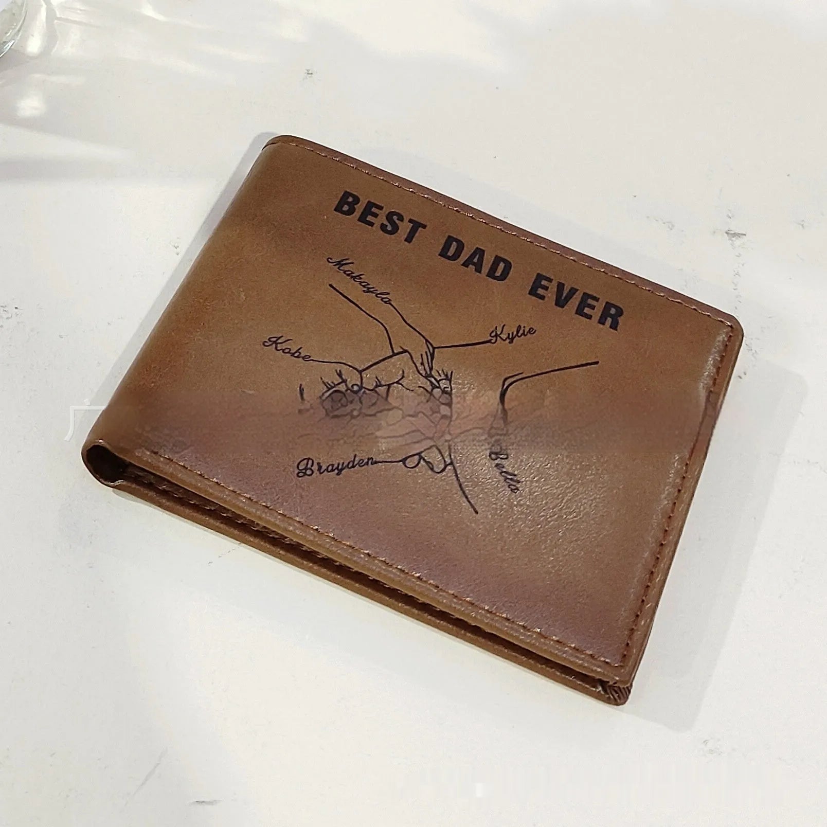 Brown personalised leather wallet with letter print, contrast stitching, and slim 10.5cm profile