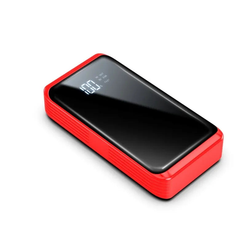 Compact 1200A car jump starter with battery clips, LED light, and USB port on a grey background