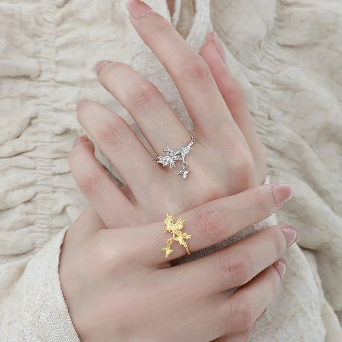 Adjustable silver ring featuring a wild butterfly design, shown in a choice of electroplated finishes.