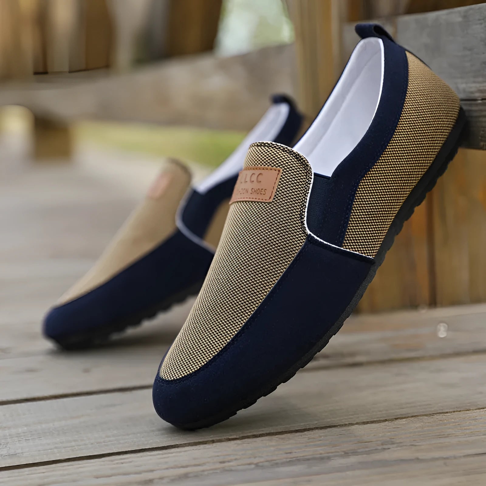 Men's grey canvas casual board shoes with round toe design and rubber soles shown from side view