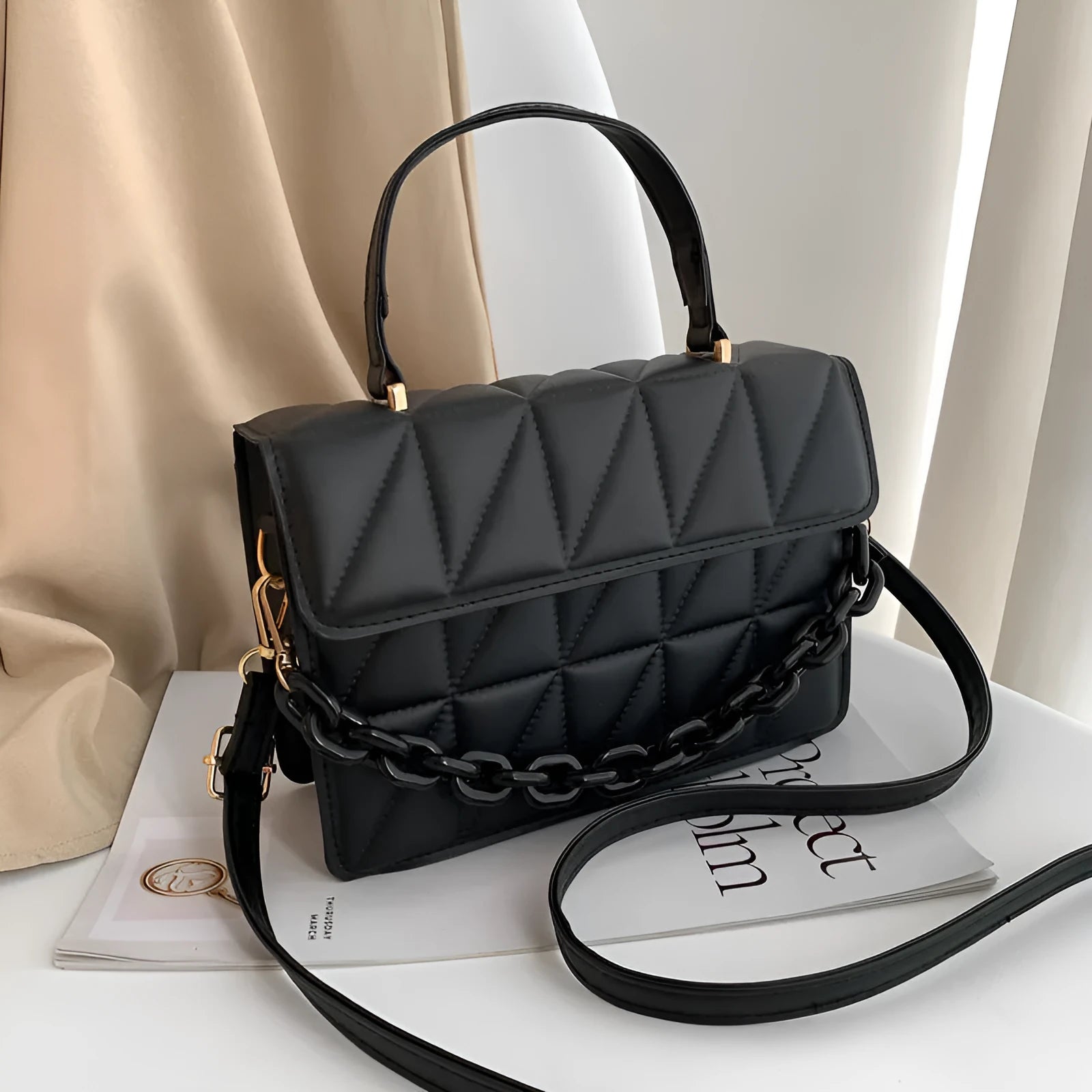 Casual small square PU shoulder messenger bag in black on a white background