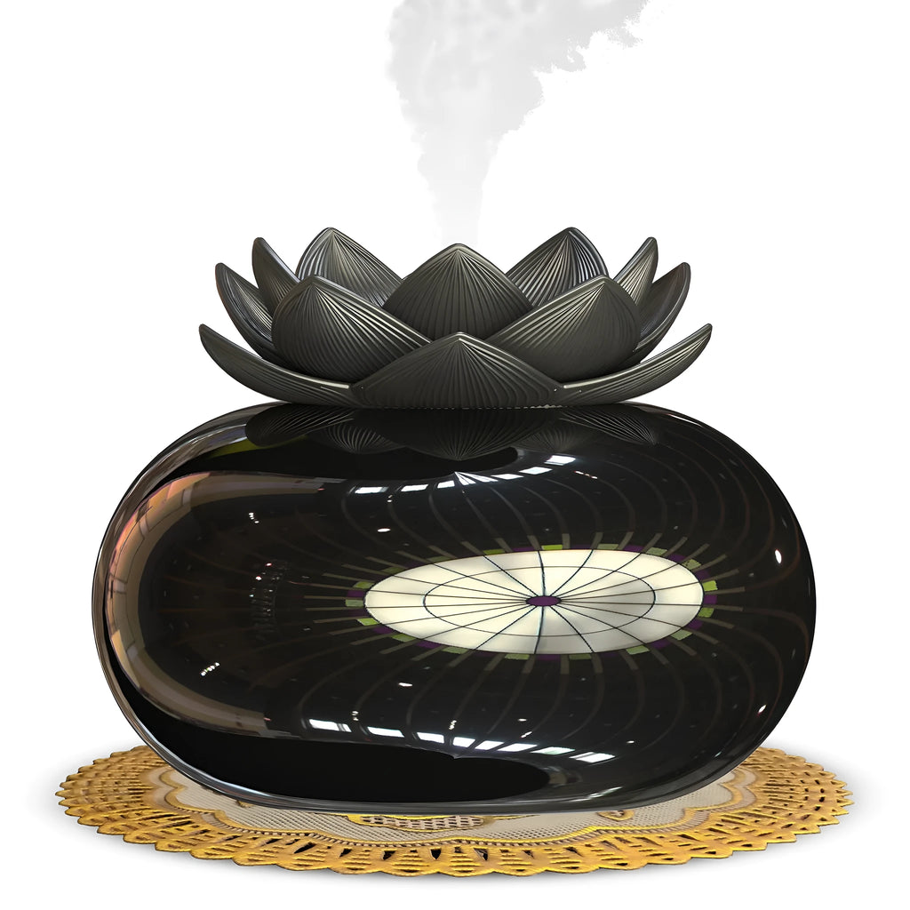 Pure black lotus-shaped aromatherapy humidifier with USB cable on a desk