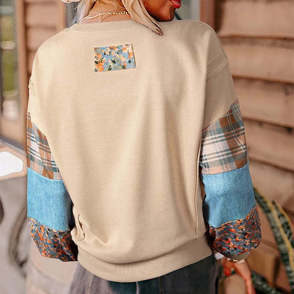 Beige and red women's loose-fit plaid long-sleeved polyester top on a hanger.