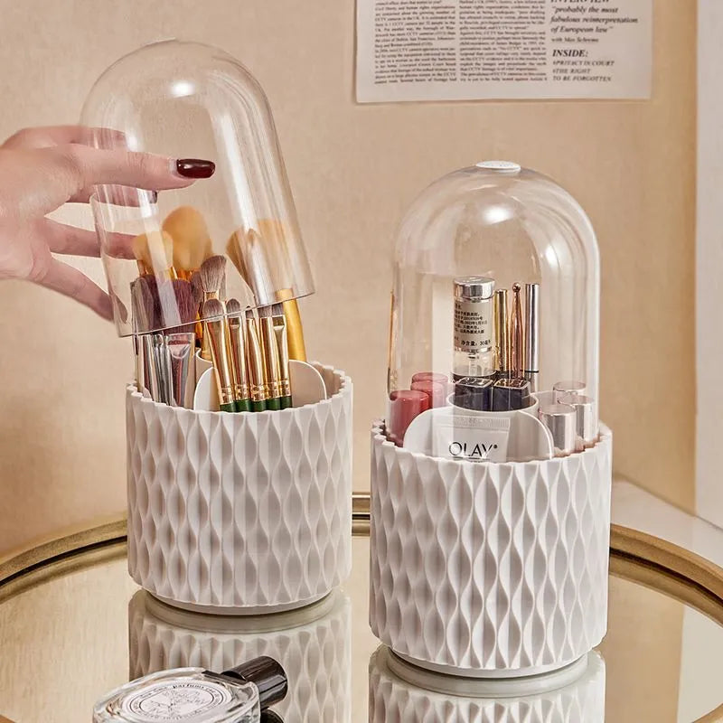 White acrylic rotating makeup brush holder with transparent dust cover showing split storage compartments