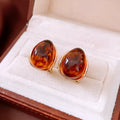 Amber water drop ear studs and ear clips in coffee colour with silver needles and electroplated resin drop shape
