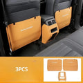 Three leather anti-kick pads for Mitsubishi Outlander seat and console protection.