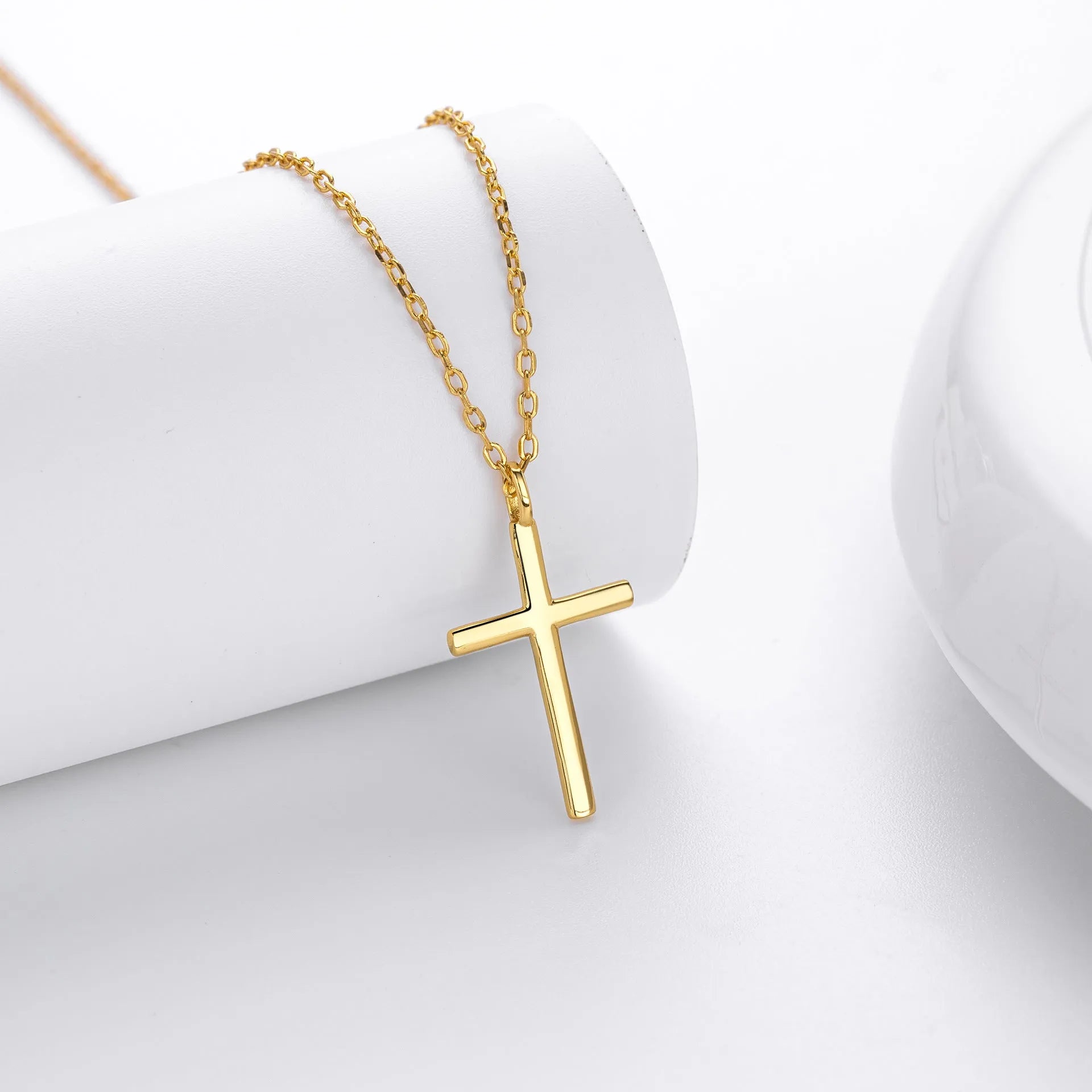 S925 sterling silver cross pendant necklace on an adjustable O-chain, shown in gold plated finish.