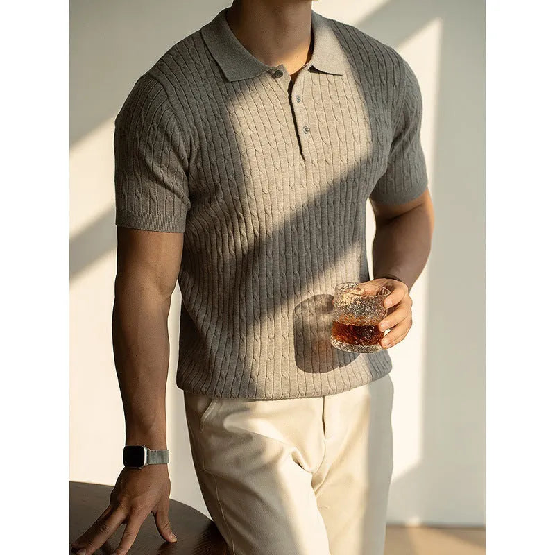 Men's khaki short sleeve business top on a hanger, showing the collar and button placket.