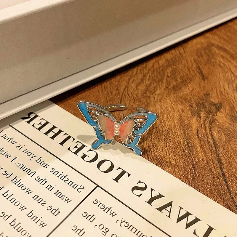Simple copper women's ring with a Chinese butterfly design, showing an example from the 33 available numbered styles.