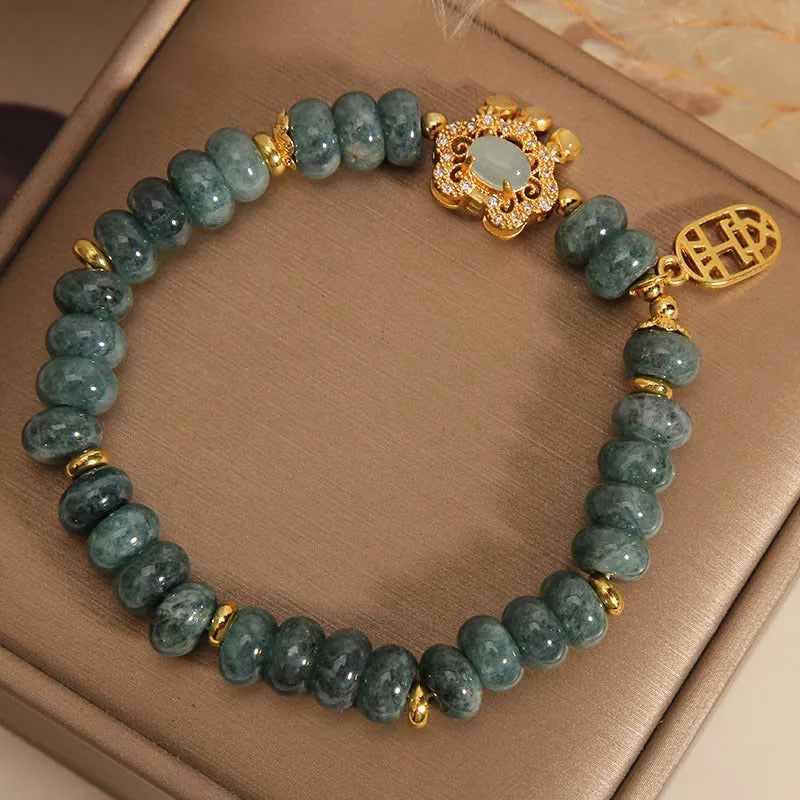Women's natural emerald jade bracelet with abacus beads and safety lock closure
