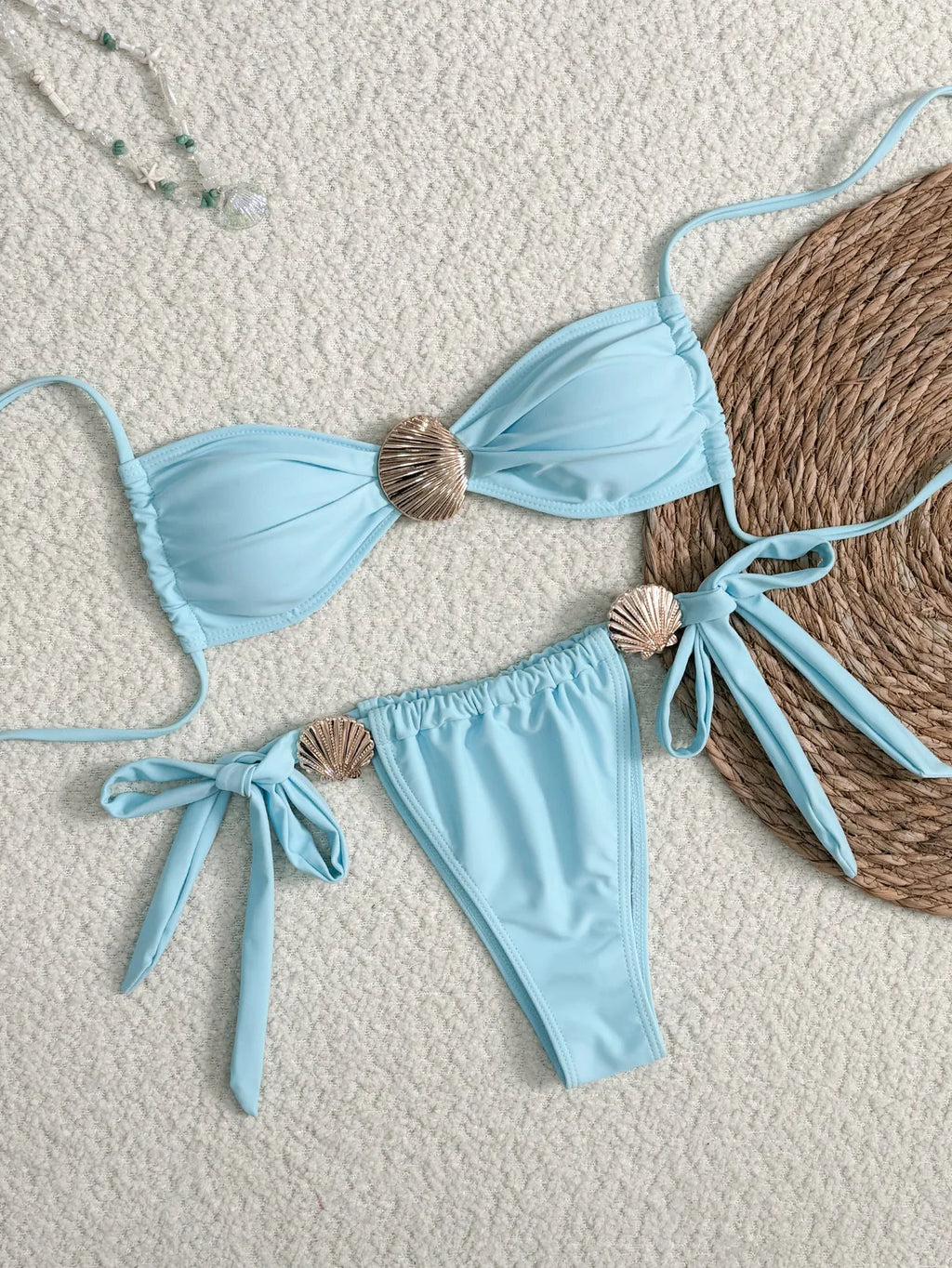 Blue women's high waist lace-up bikini swimsuit in polyester with metal shell detail on briefs