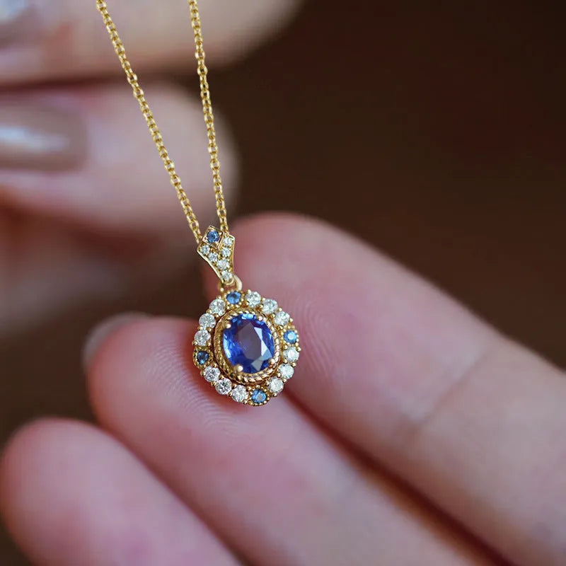 Yellow gold royal style necklace with zircon and gemstone pendant on an adjustable copper box chain.