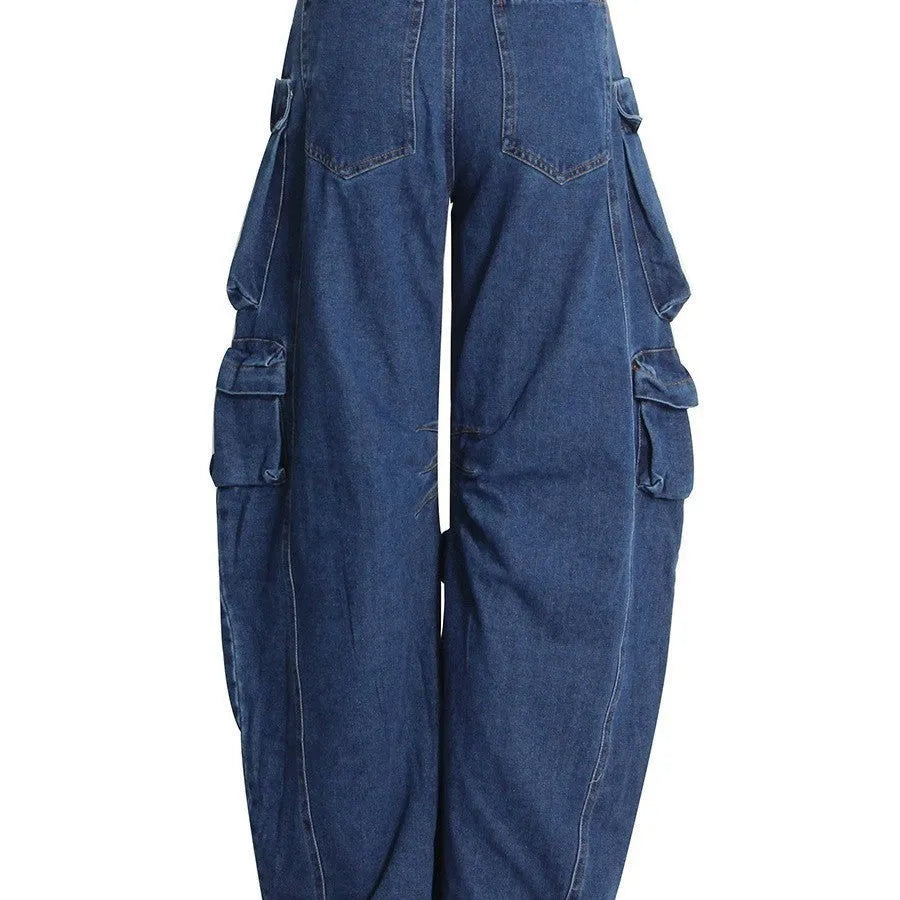 Dark blue distressed wide-leg jeans with a high waist and multiple pockets laid flat