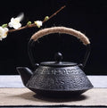 Japanese-style cast iron teapot with traditional patterns and 0.9L capacity for tea brewing
