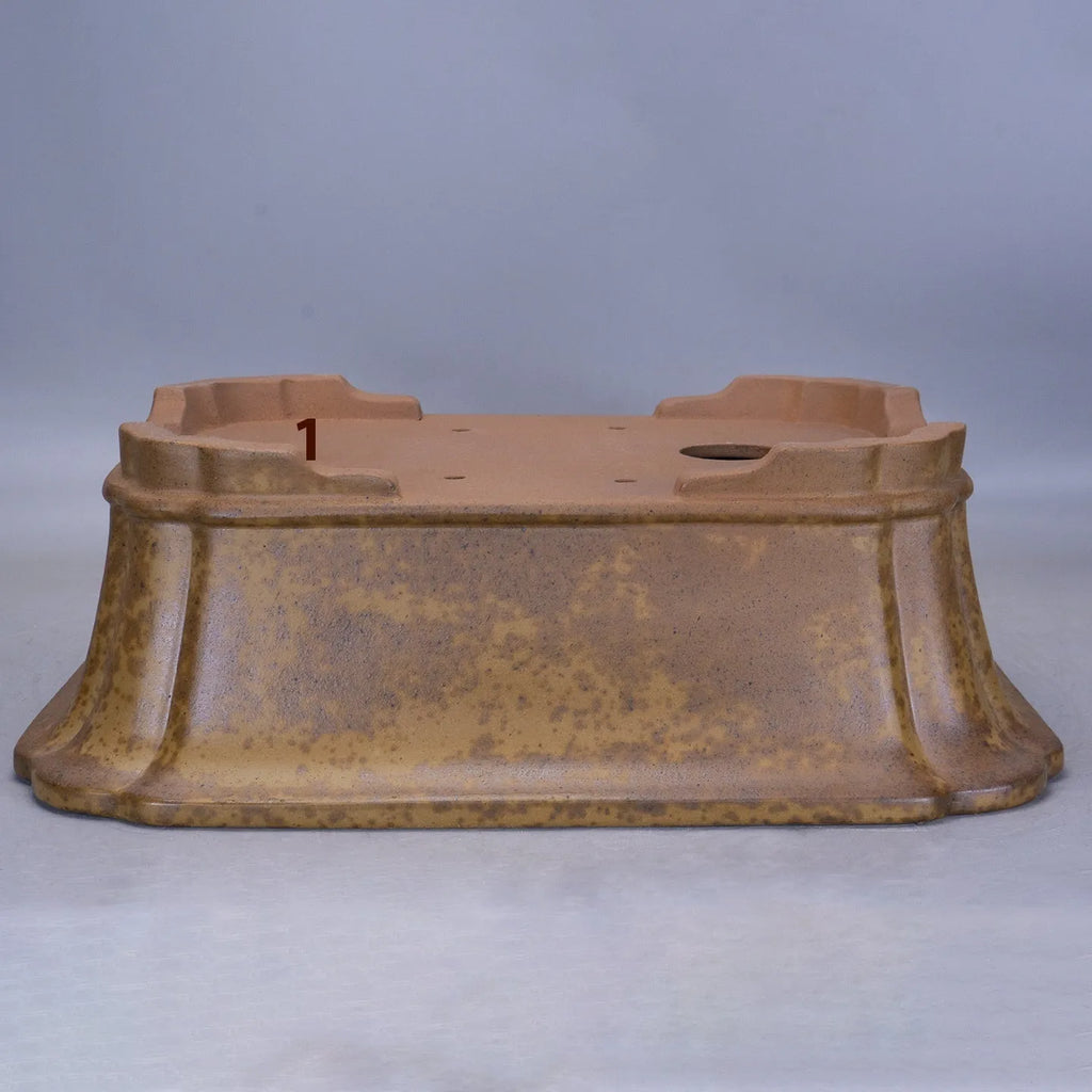 Large rectangular purple sand flowerpot with modern segmented design on a floor.