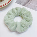 Fashion simple solid colour cloth hair ring for women in round ring loose style, available in 12 colours.