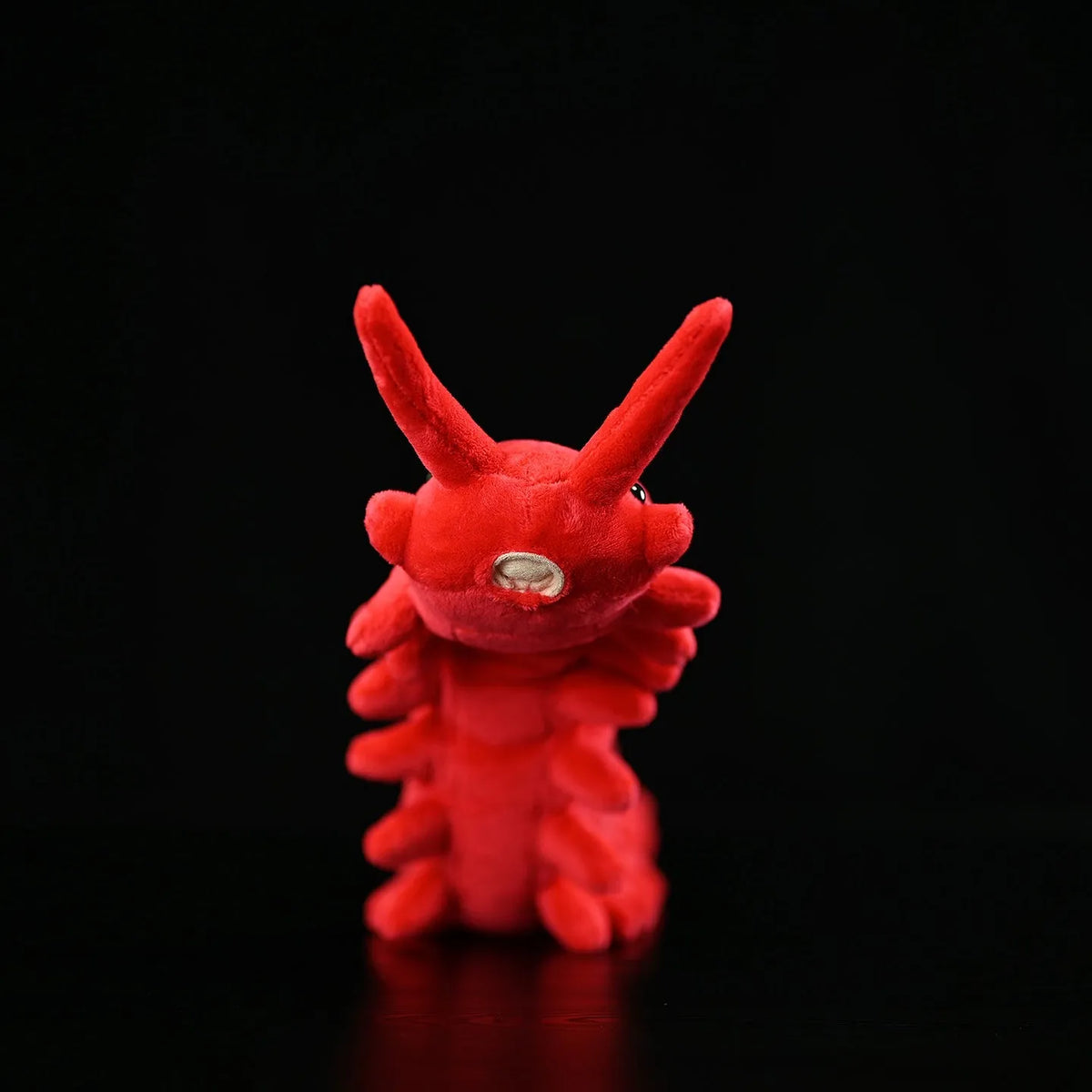 Red velvet worm plush toy silkworm doll 60cm long soft stuffed animal on a plain background