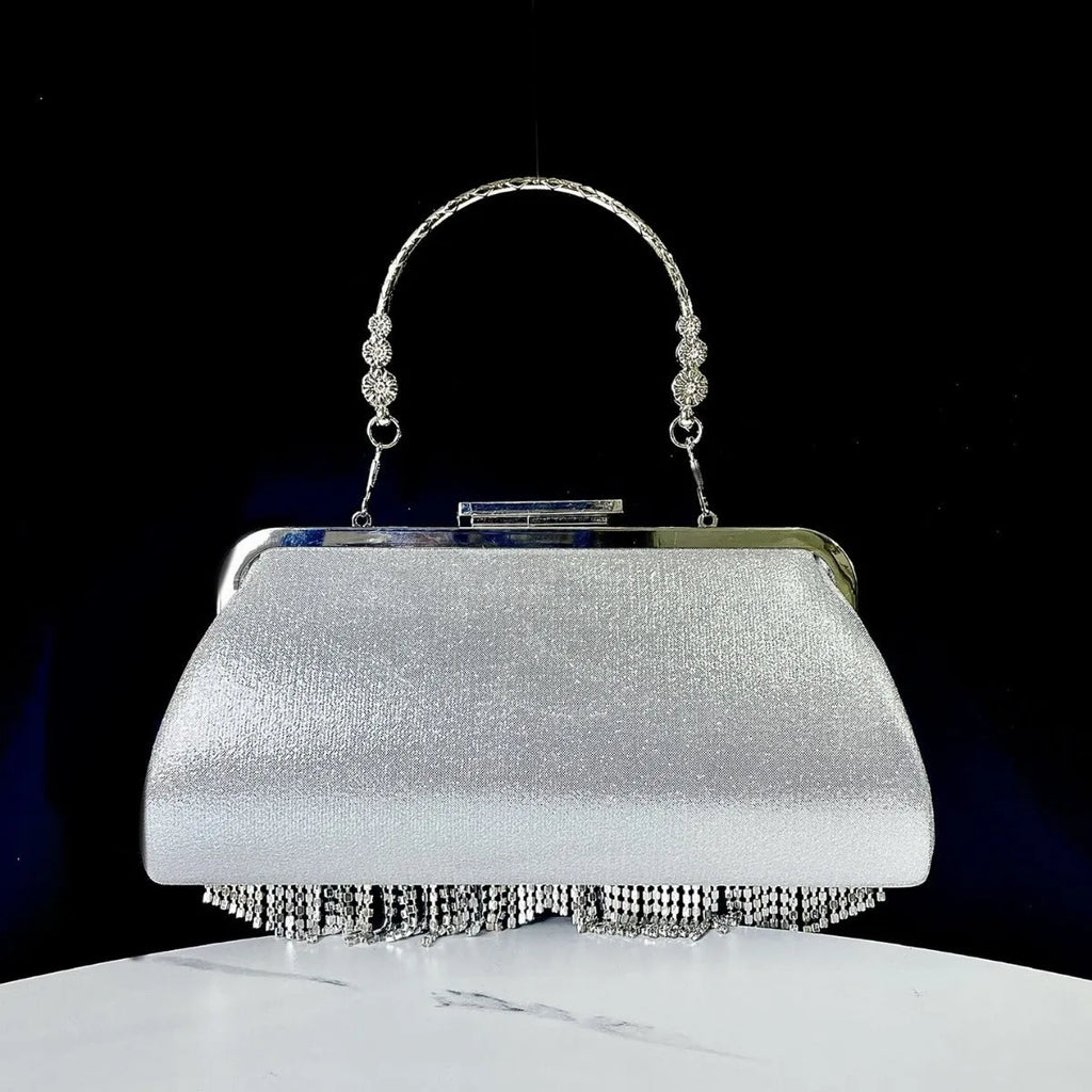 Tassel crossbody banquet bag in polyester shell shape with diamond chain and open pocket, available in black, gold, or silver