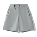 Men's solid colour sports shorts with 3D cut and stretch fabric for running.