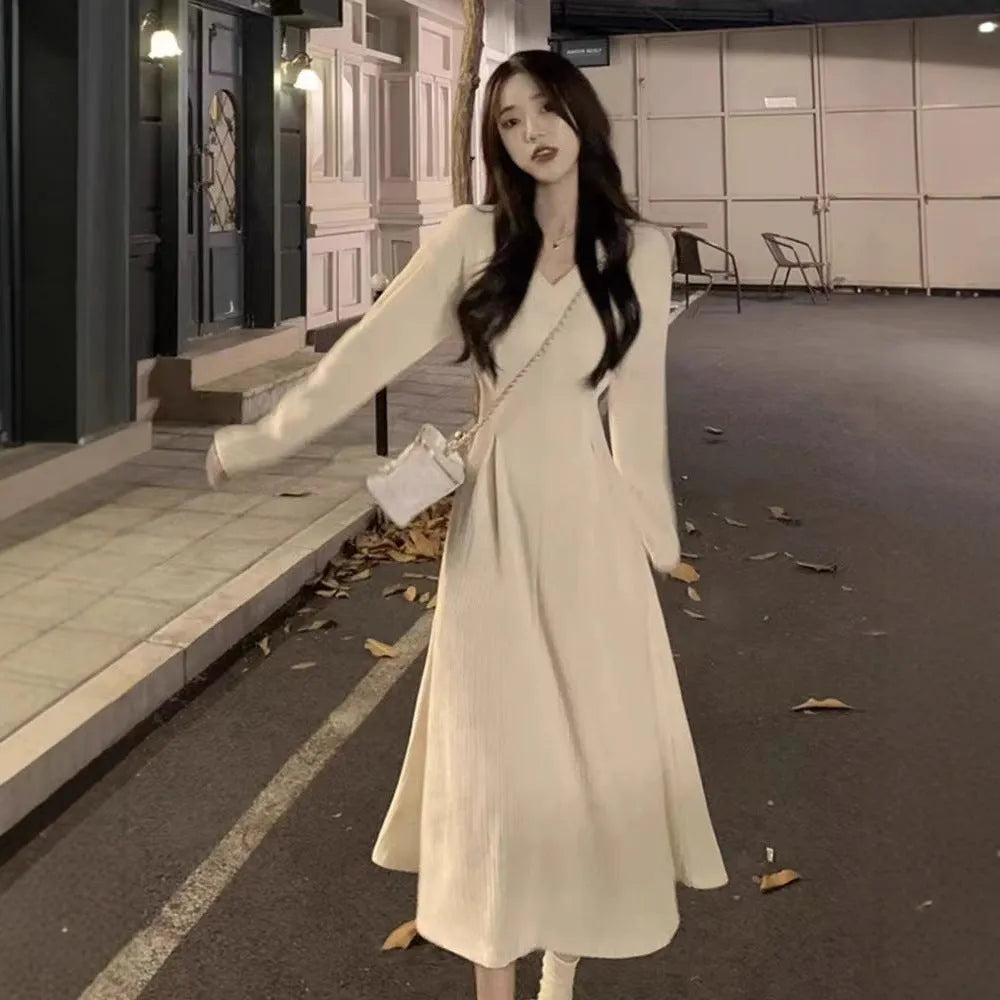 Women's V-neck knitted dress sweater in polyester with long skirt and princess sleeves