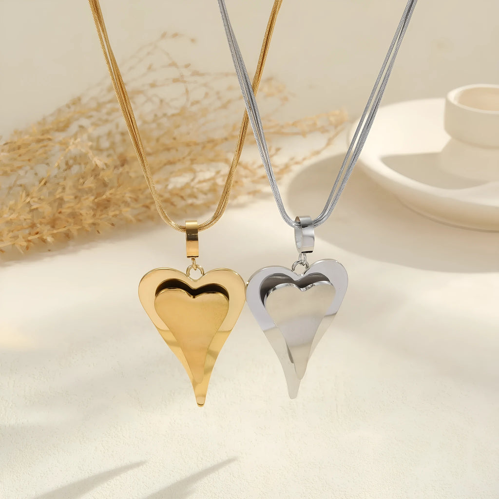 Women's stainless steel snake bones chain necklace with geometric double heart pendant