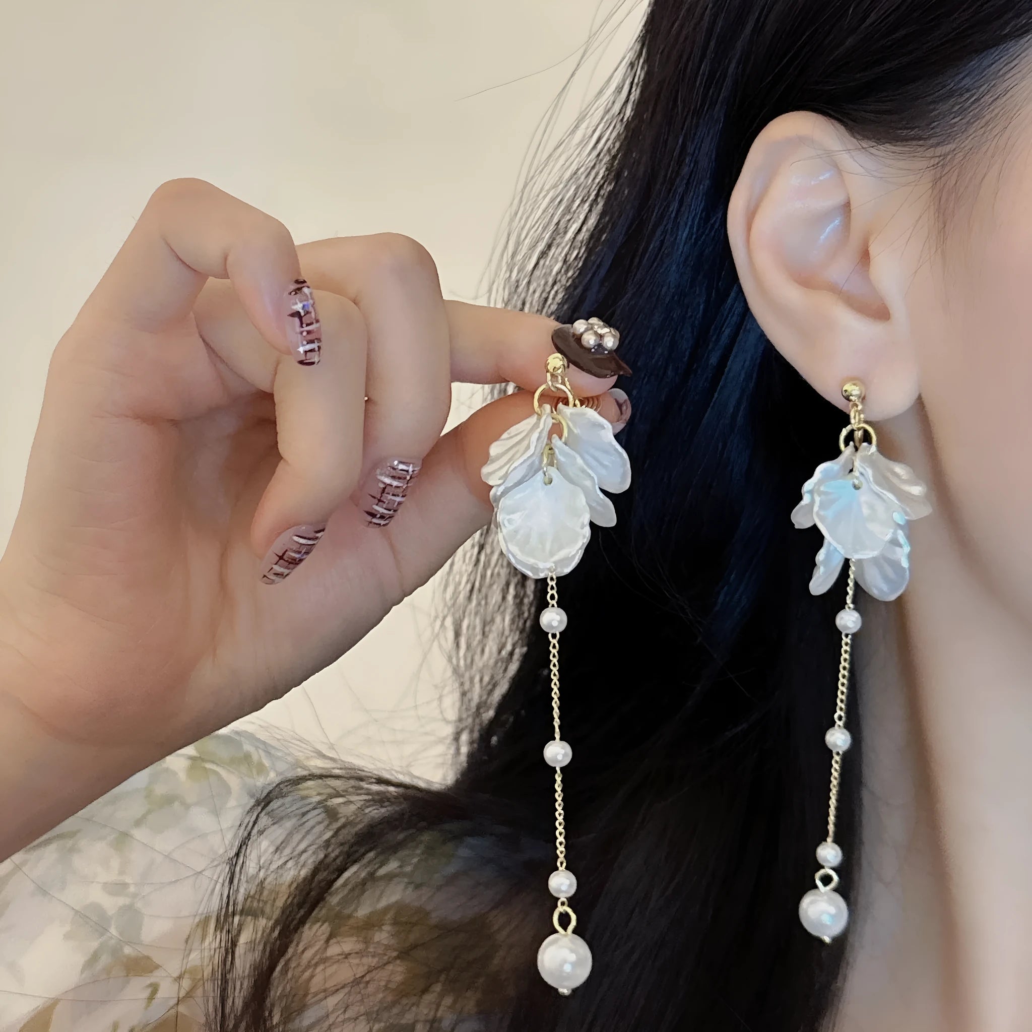 Long 8.8cm acrylic shell pearl tassel earrings for women with a choice of ear clip types.