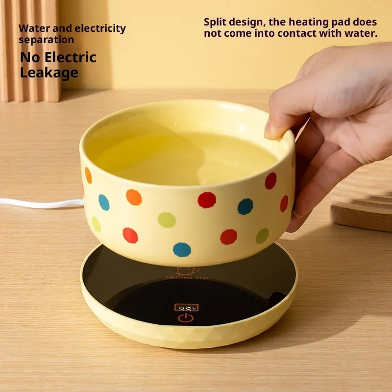 Ceramic cat water bowl with heating mat on white background