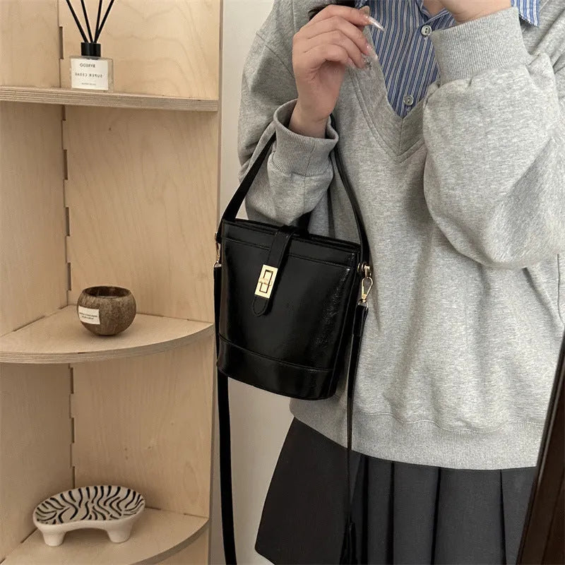 Women's one shoulder crossbody bag bucket shape in PU leather, available in black, brown, khaki, white. Width 19cm height 18.5cm.