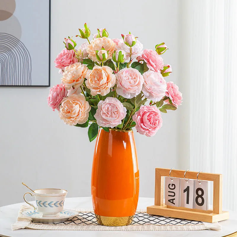 Fake flower decoration silk bouquet in eight mixed colours on a living room shelf