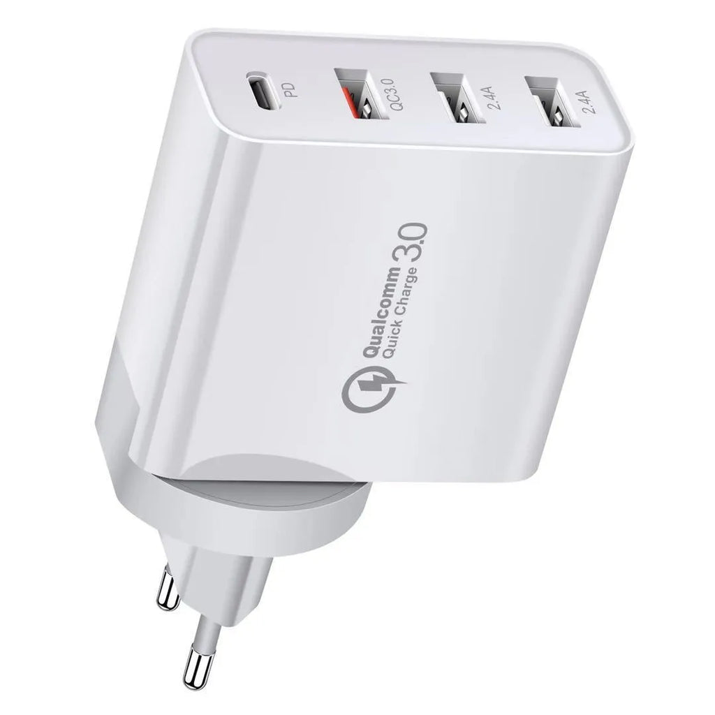 White fast charger with multiple USB ports and a UK plug on a wooden table.
