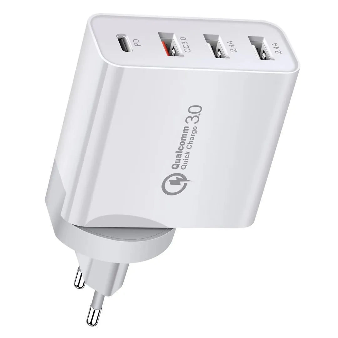 White fast charger with multiple USB ports and a UK plug on a wooden table.