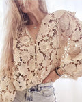 Women's loose fit black lace V-neck cardigan shirt featuring a three-dimensional white lace flower decoration on the chest.