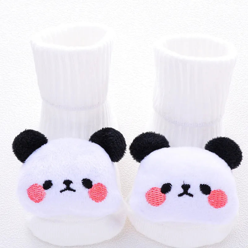 Cotton baby floor socks in various colours and patterns including pink bows, grey stars, and panda design.