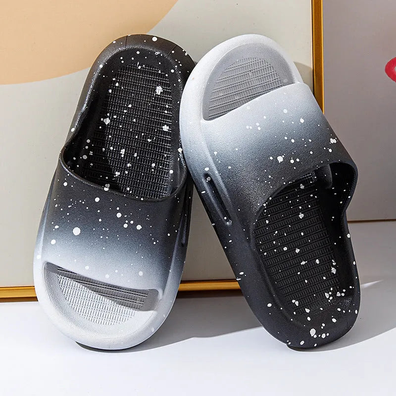 Blue gradient PVC slippers for children on a white background showing the non-slip sole pattern.